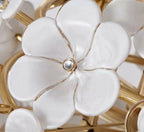 Close Up View of White Ceramic Petals and Brass Stamens