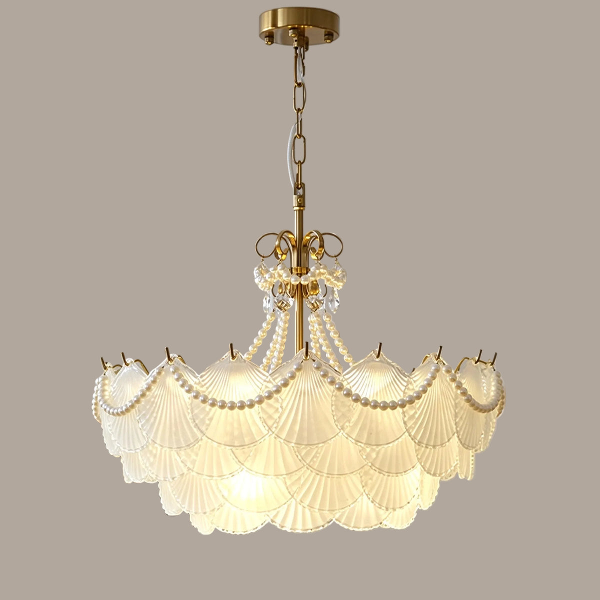 Illuminated Modern Brass Beaded Shell Art Glass Chandelier Studio Shot on Pure White Background