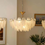 Gold Feather Glass Chandelier featuring sculpted glass shades and a polished gold frame