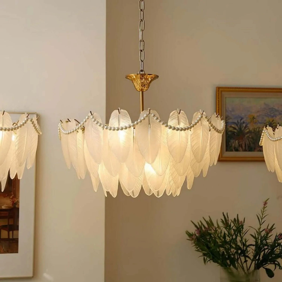 Gold Feather Glass Chandelier featuring sculpted glass shades and a polished gold frame