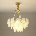 Close-up of the Gold Feather Glass Chandelier's gold frame and glass shade connections