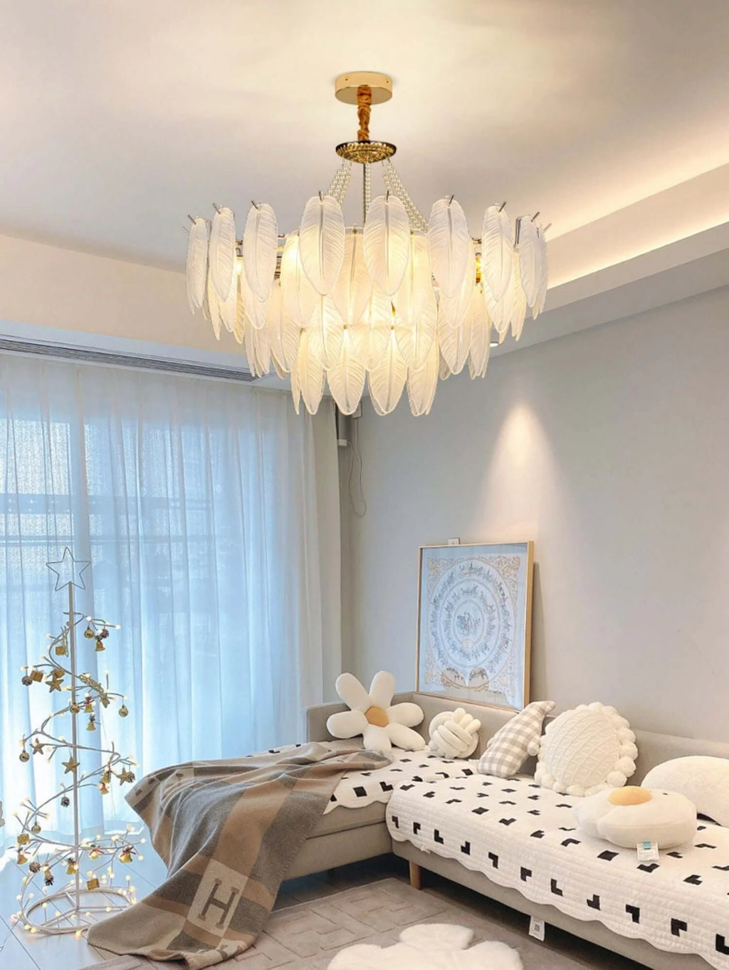 Gold Feather Glass Chandelier in an elegant neutral living room with large windows