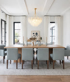 Gold Feather Glass Chandelier in a contemporary kitchen with a marble island