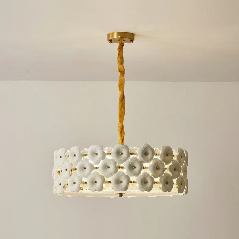 Side View of Illuminated Modern White Floral Chandelier Studio Shot