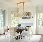 Modern Brass Double-Tier White Floral Linear Chandelier Over Round Dining Table