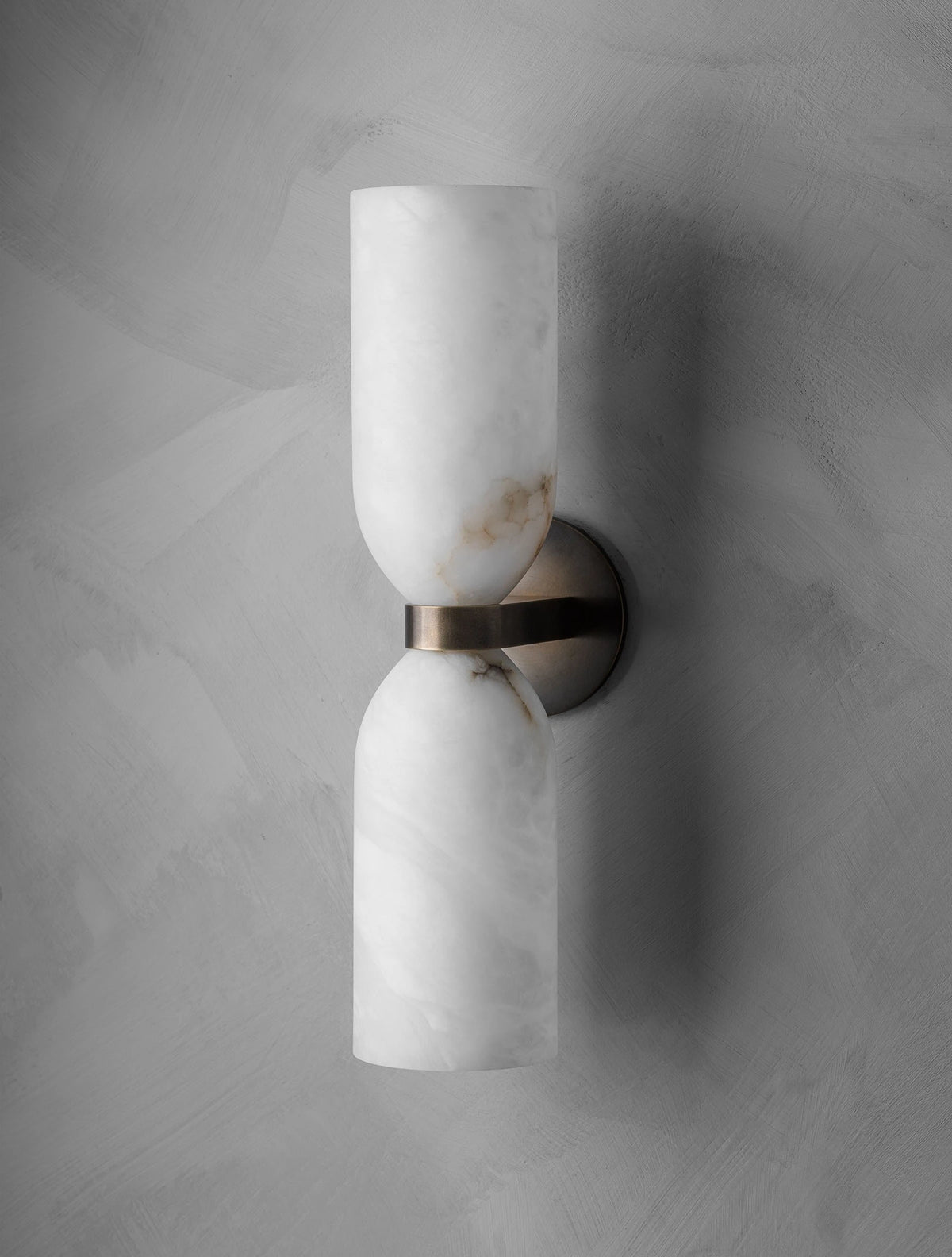Side View of Illuminated Modern Alabaster Cylinder Wall Sconce