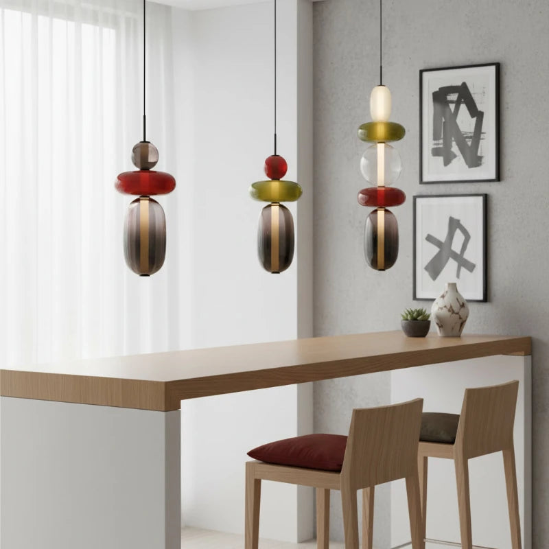 Set of Glass Totem Pendant Lights Over Dining Counter
