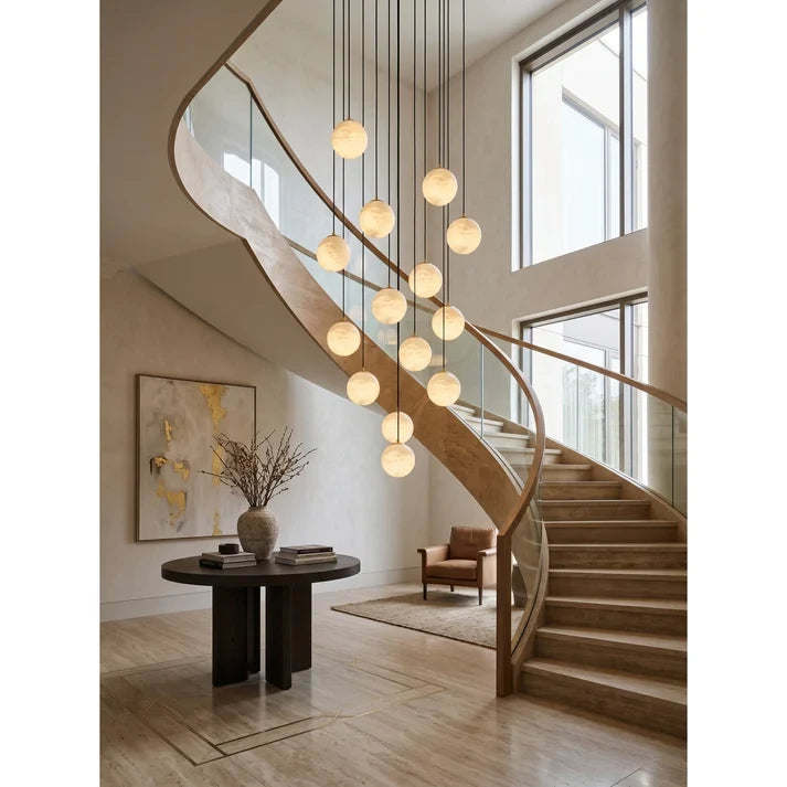 Modern Alabaster Globe Waterfall Chandelier Over Spiral Staircase