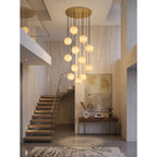 Modern Alabaster Globe Chandelier Over High Ceiling Living Space