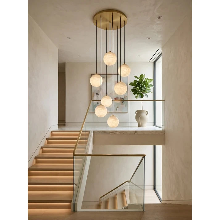 Modern Brass Alabaster Globe Chandelier Over Modern Staircase