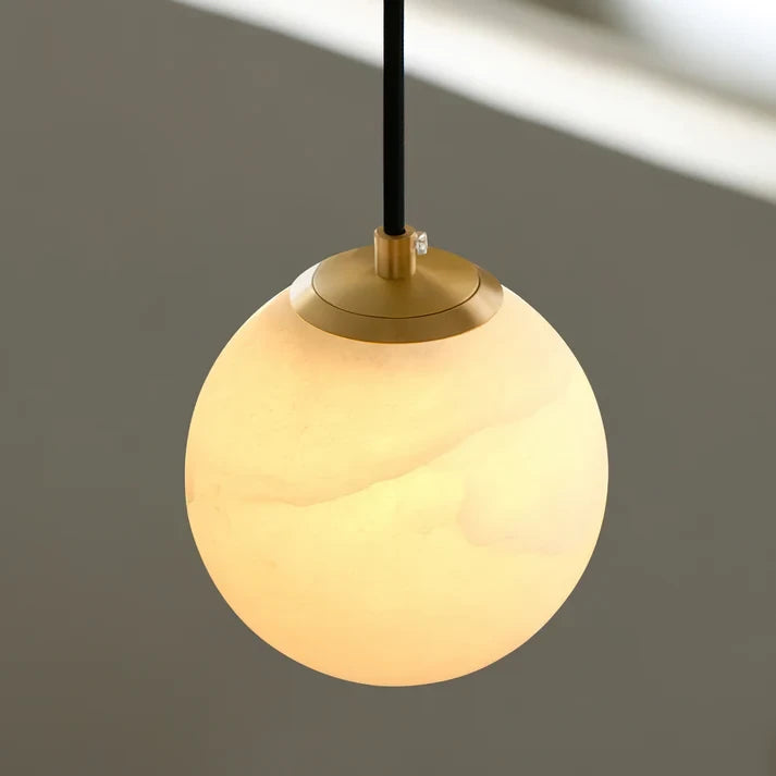 Detail View of Glowing Alabaster Globe Shade and Brass Cap
