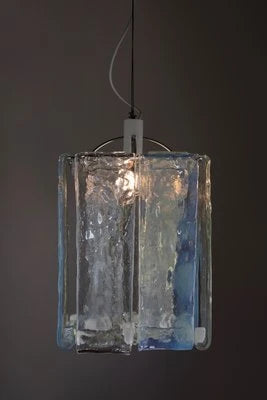 Illuminated Modern Silver Crystal Block Pendant Light with Iridescent Glow on Dark Background