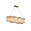 Modern Brass and Crystal Irregular Disc Art Glass Linear Chandelier with Gold Canopy on Pure White Background