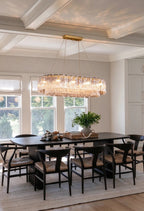 Modern Brass Crystal Irregular Disc Linear Chandelier in Elegant Dining Setting