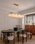 Modern Brass Crystal Irregular Disc Linear Chandelier in Dining Room Setting