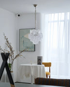 Modern White Disc Art Glass Chandelier in Bright Living Space