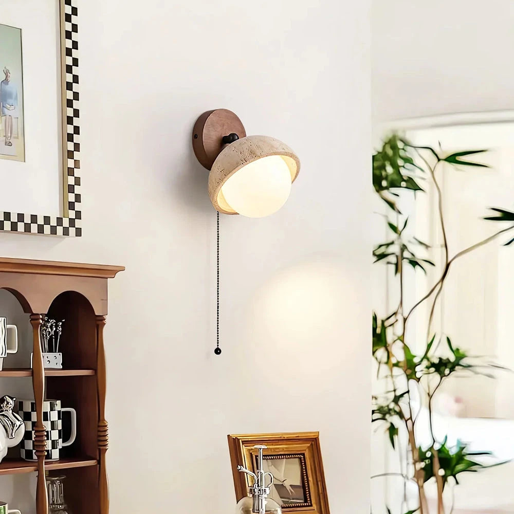 Single Travertine Wall Sconce Over Living Room Cabinet