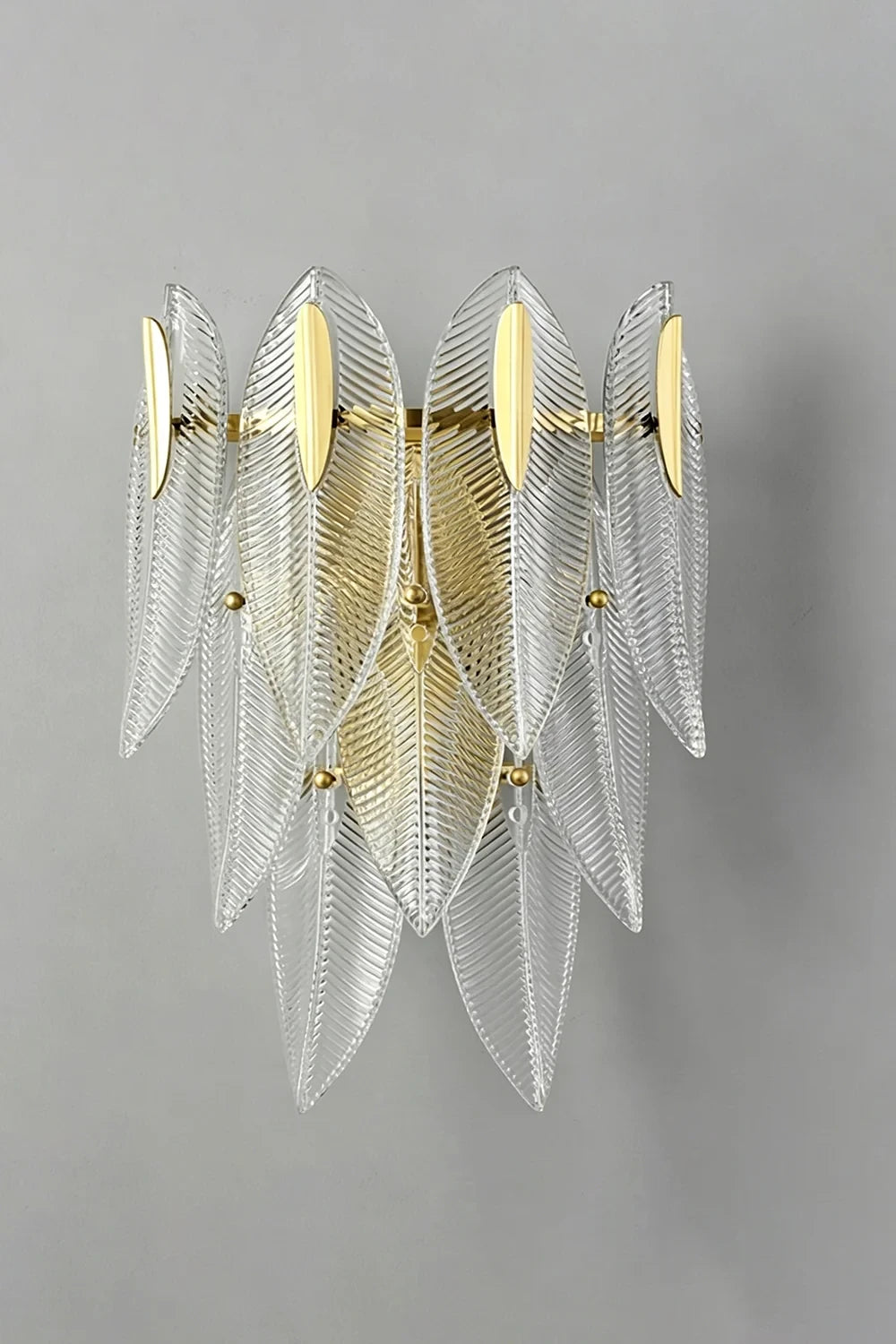 Illuminated Modern Brass and Feather Art Glass Wall Sconce Studio Shot