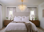 Modern Brass Feather Chandelier in Cozy Master Bedroom