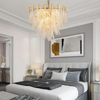 Modern Brass Feather Chandelier in Master Bedroom Interior