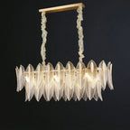 Illuminated Modern Brass and Linear Feather Art Glass Chandelier on Black Background