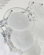 Close Up View of White Disc Glass Shades and Silver Metal Connector Structure