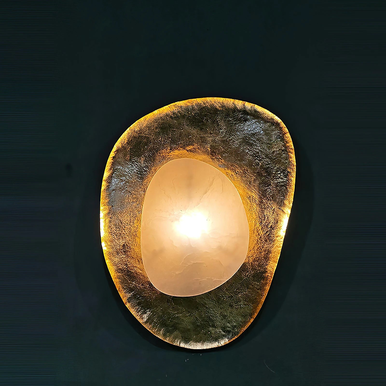 Illuminated Organic Gold Foil Alabaster Sconce on Dark Wall