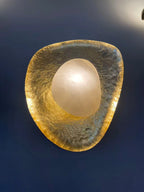 Gold Foil Pebble Alabaster Sconce Studio Display on Dark Blue Wall