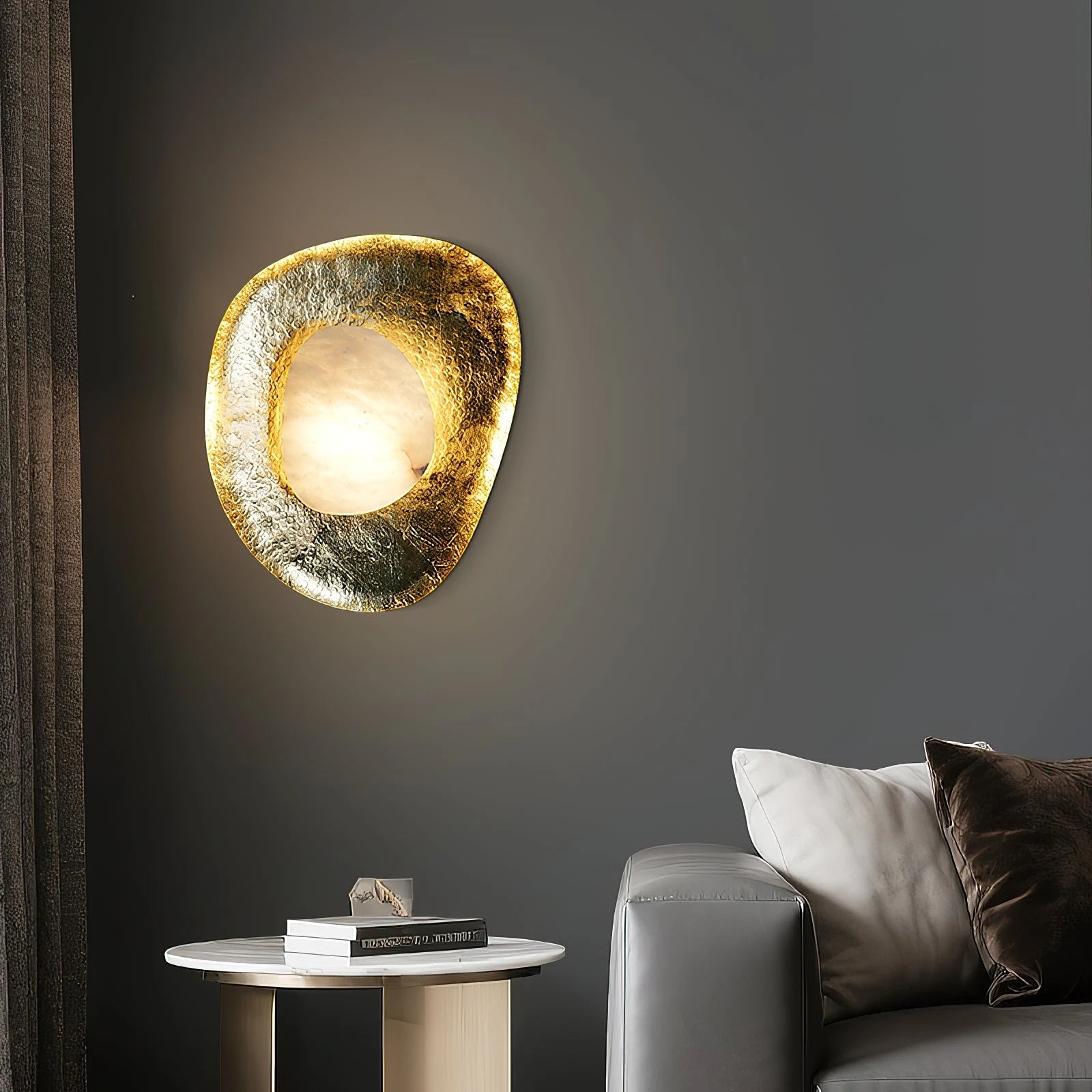 Organic Pebble Gold Sconce Over Modern Living Room Side Table