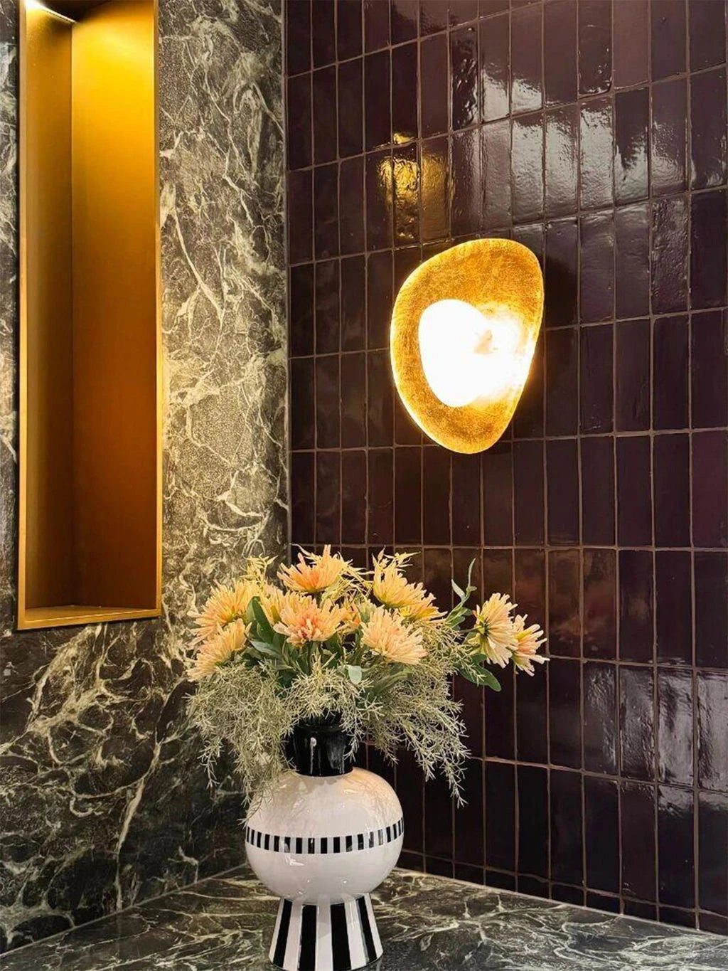 Gold Foil Organic Wall Light Mounted on Textured Marble Wall