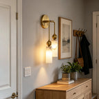 Modern Double-Light Brass Wall Sconce Over Console Table