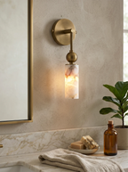Modern Brass Cylinder Wall Sconce in Bathroom Setting