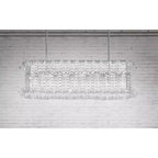 Illuminated Modern Rectangular Crystal Prism Linear Chandelier on Textured Wall
