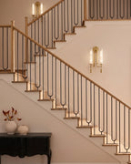 Modern Alabaster Wall Sconces Along Staircase Hallway
