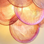 Close Up View of Pink Colorful Disc Glass Texture and Light Pattern