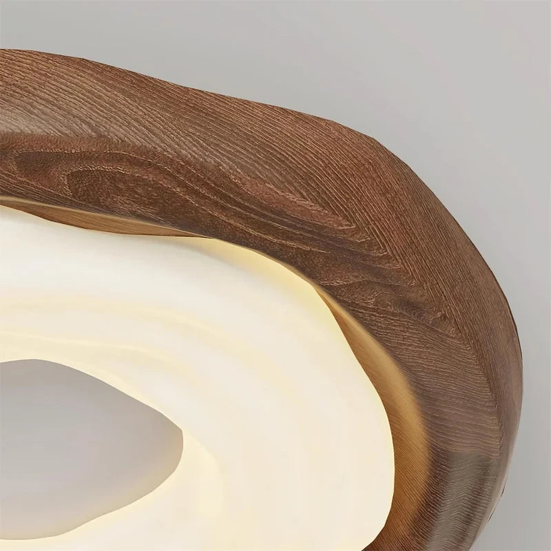 Close Up View of Organic Wood Grain and Glowing Diffuser on Ceiling Light