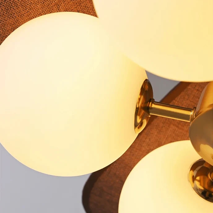 Close Up View of Spherical Glass Globes and Wooden Petal Details