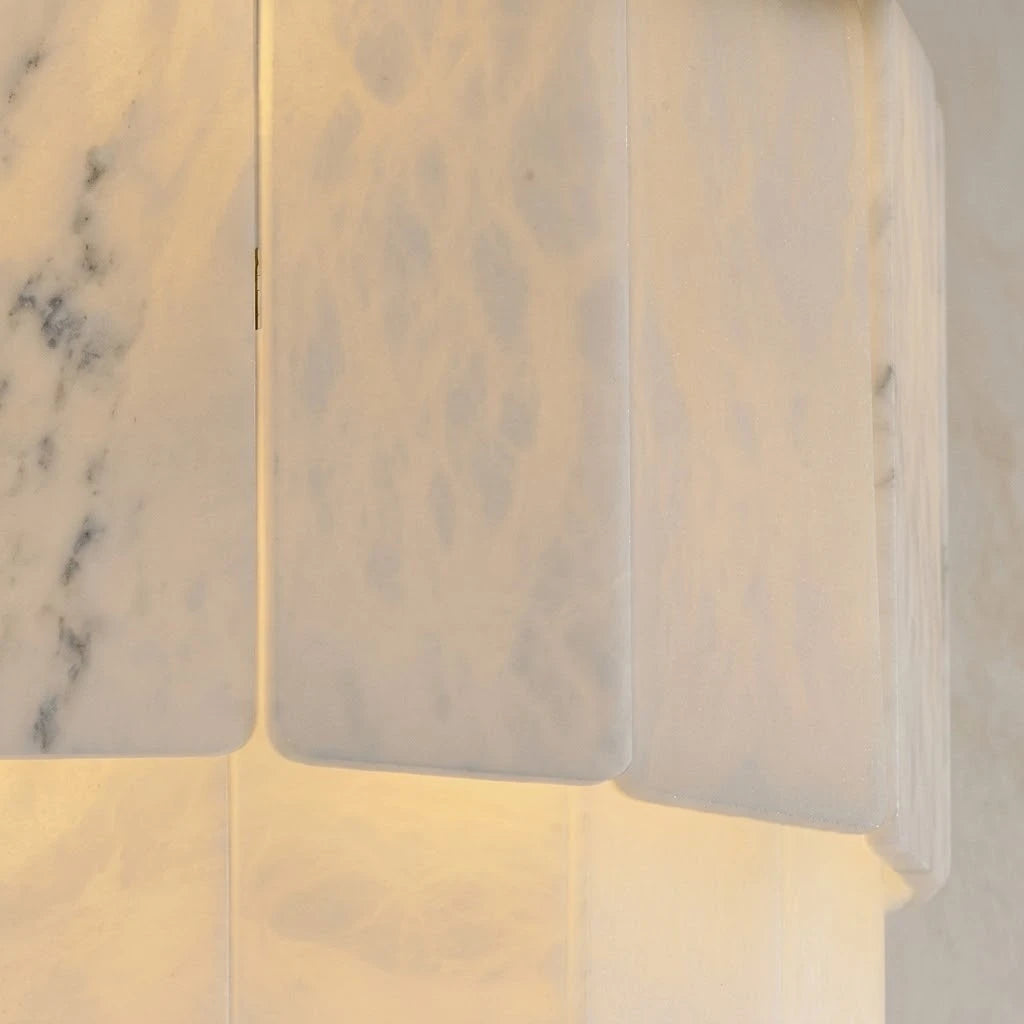 Pair of Travertine Wall Lights Illuminating Elegant Hallway