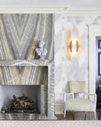 Modern Capsule Alabaster Wall Sconce Over Fireplace Setting