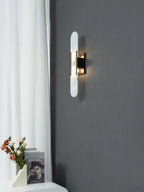 Modern Capsule Alabaster Wall Sconce with Black Hardware on Dark Wall