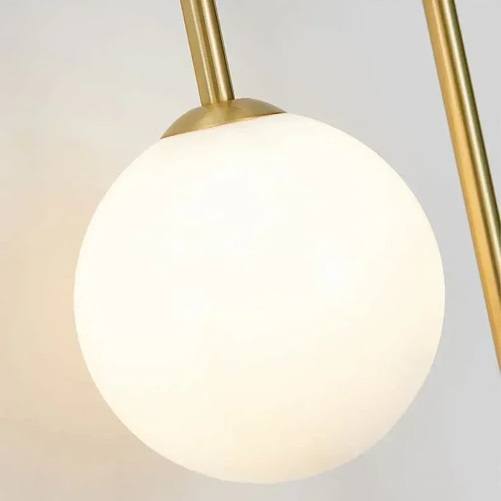 Close Up View of Illuminated Opal Glass Globe Shade and Warm Glow Details