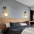 Modern Brass Curved Tube Wall Sconce in Master Bedroom Suite