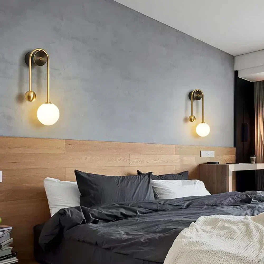 Modern Brass Curved Tube Wall Sconce in Master Bedroom Suite