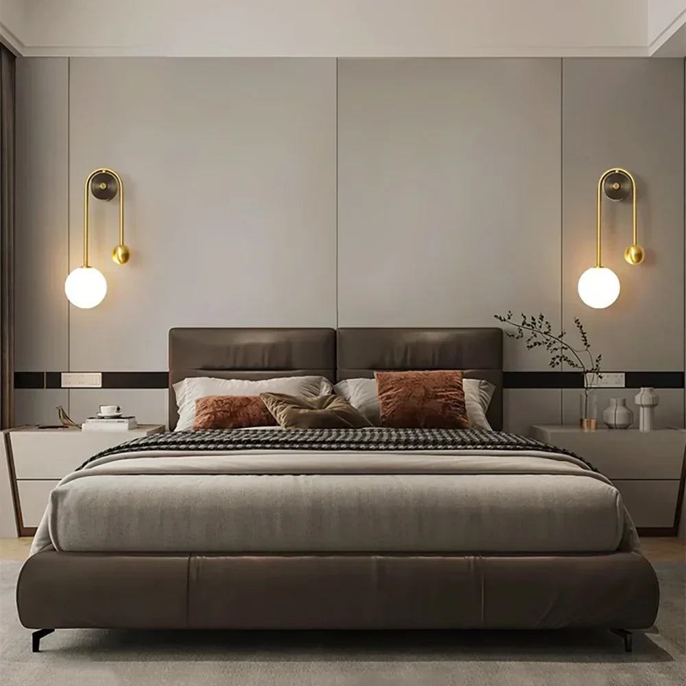 Modern Brass Globe Wall Sconce in Elegant Master Bedroom