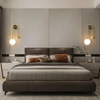 Modern Brass Globe Wall Sconce in Elegant Master Bedroom