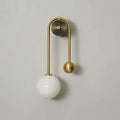 Illuminated Modern Brass Curved Tube Wall Sconce Studio Shot on White Background