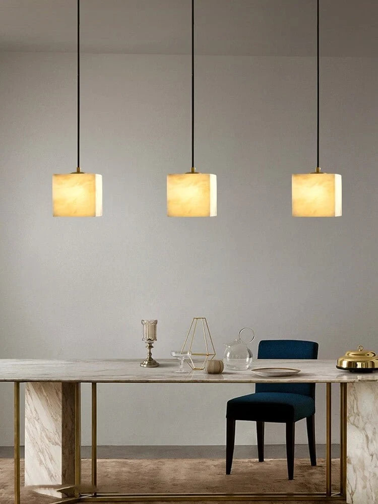 Modern Cube Alabaster Pendant Lights Over Dining Area