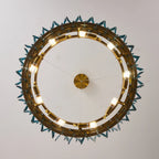 Top View of Illuminated Modern Antique Brass Teal Crystal Chandelier