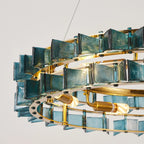 Close Up View of Illuminated Teal Crystal Chandelier Suspension Structure
