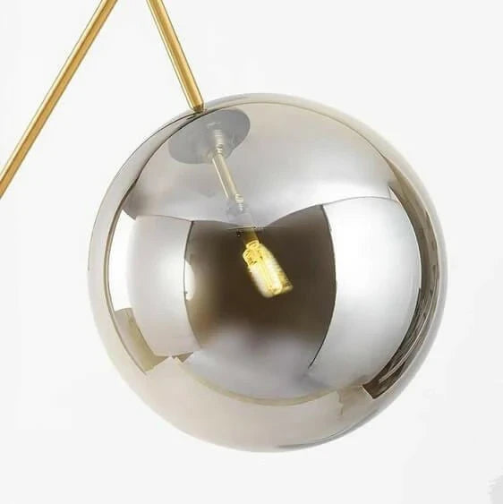 Close Up View of Smoked Glass Globe and Brass Joint